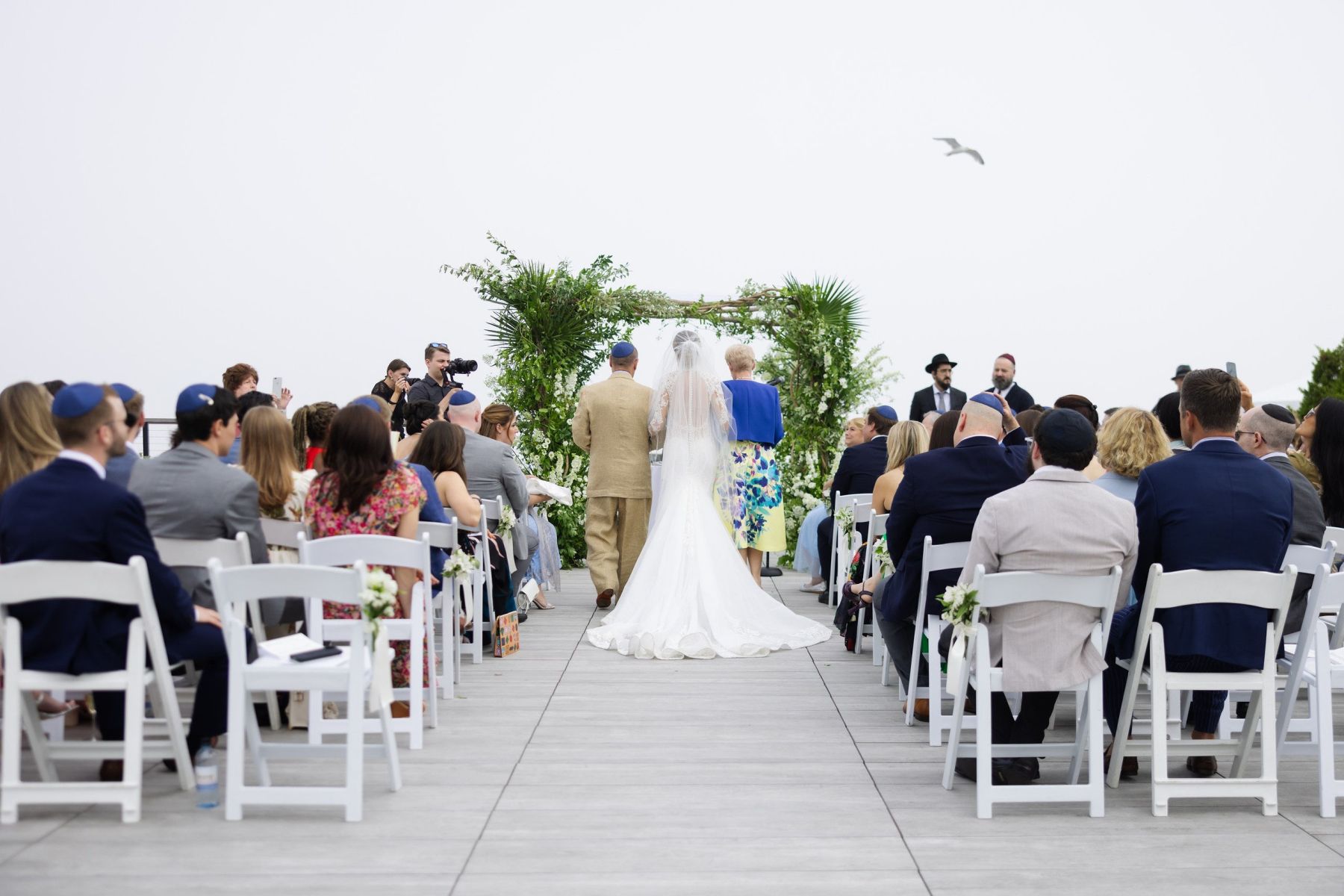 Beach Chic Vows: Ally and Dylan's Serene Gurney's Montauk Wedding photo