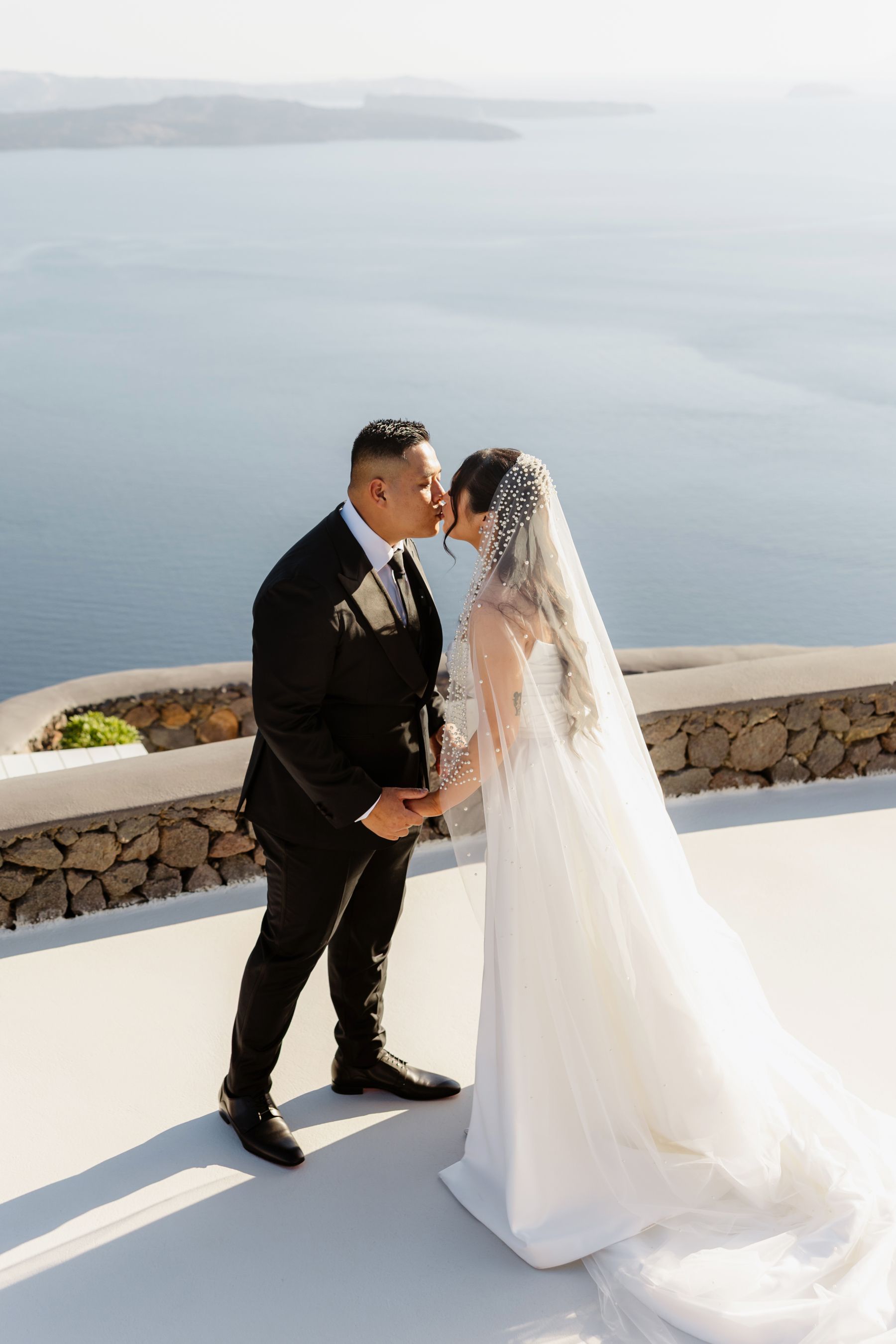 “Fourteen Years Later, He Reminds Me It Was Love at First Sight”: Janet &amp; Anthony’s Wedding at Aenaon Villas, Santorini photo