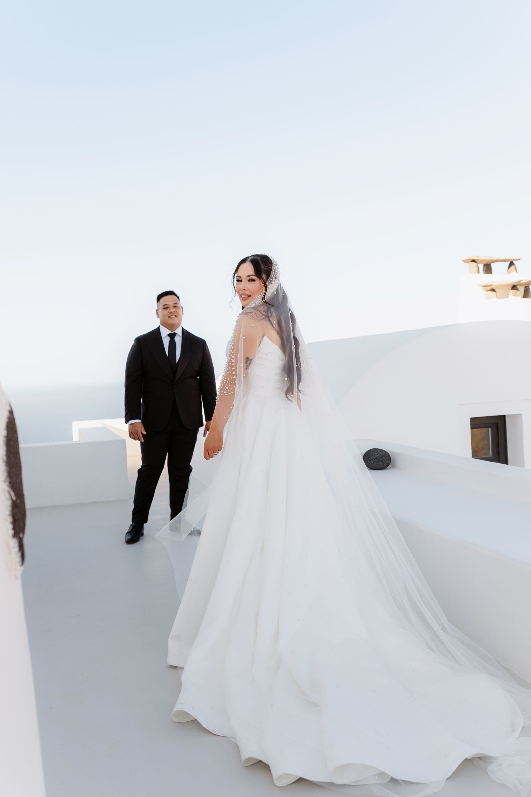 “Fourteen Years Later, He Reminds Me It Was Love at First Sight”: Janet &amp; Anthony’s Wedding at Aenaon Villas, Santorini photo