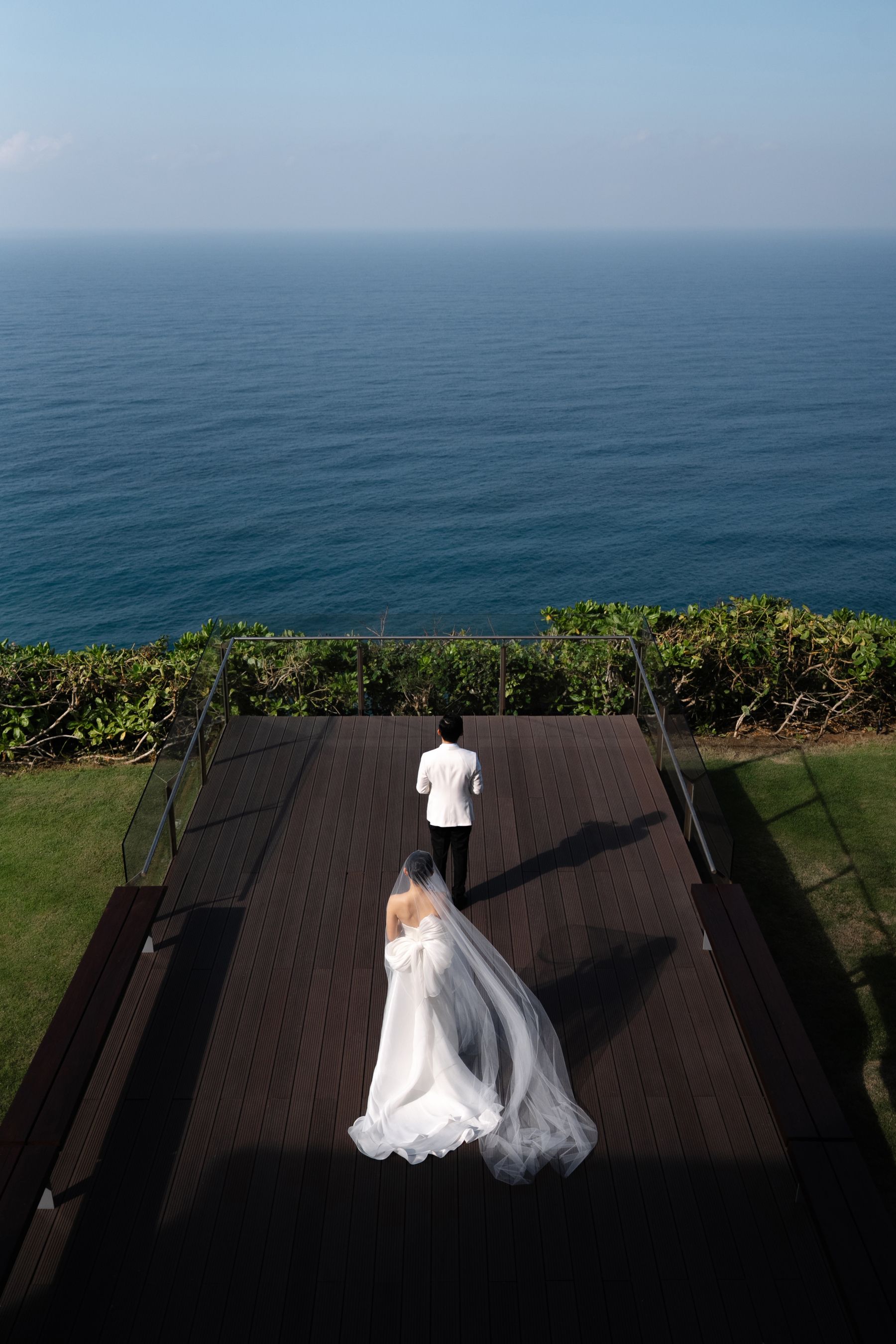 A Mirrored Aisle and a Bali Sky: Nouva &amp; Hary's Wedding at Six Senses Uluwatu photo