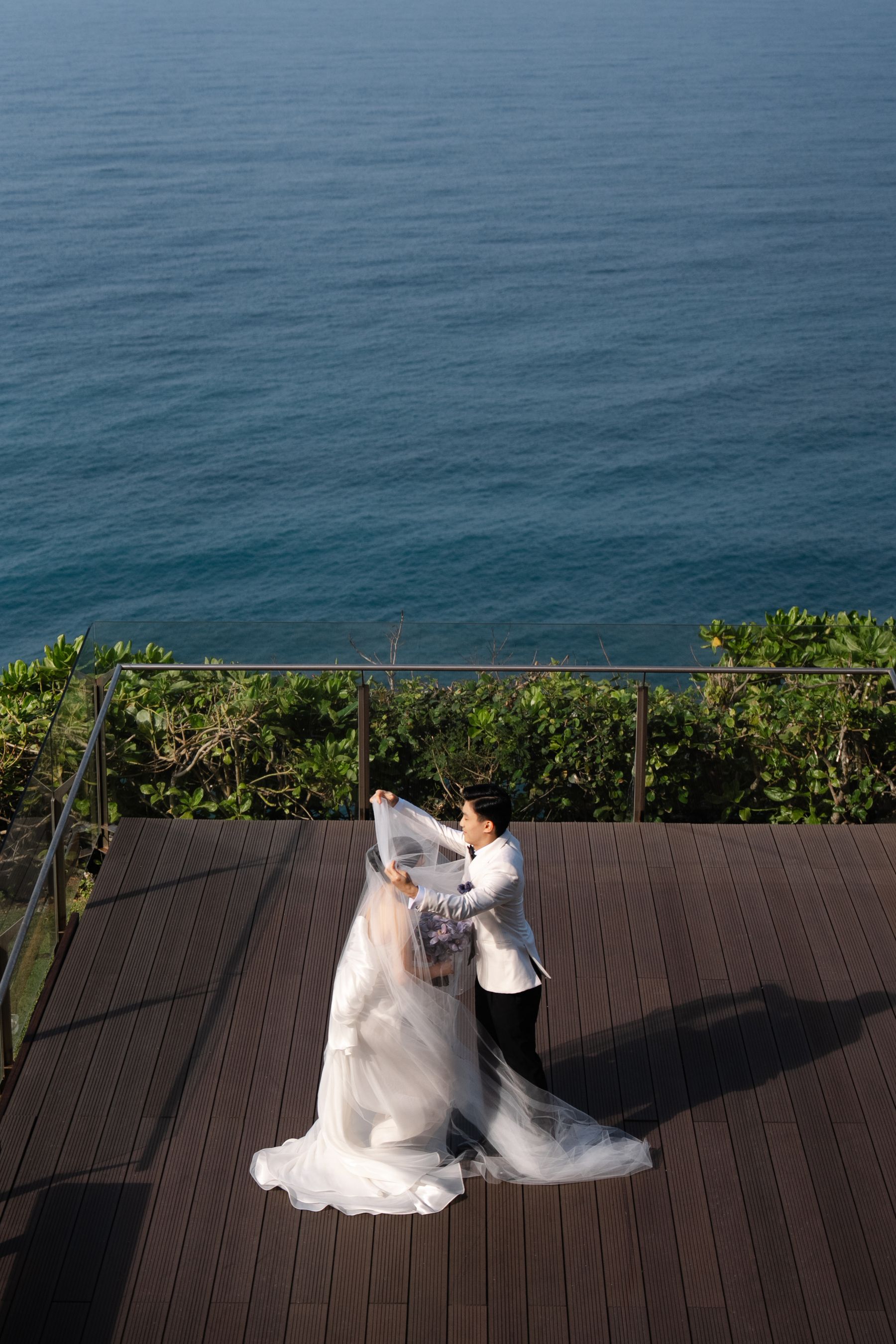 A Mirrored Aisle and a Bali Sky: Nouva &amp; Hary's Wedding at Six Senses Uluwatu photo
