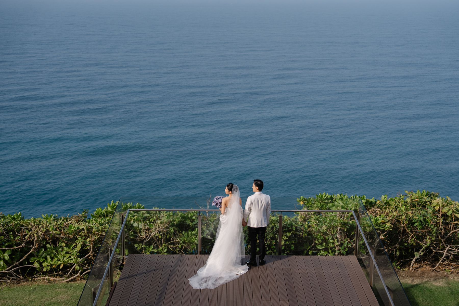 A Mirrored Aisle and a Bali Sky: Nouva &amp; Hary's Wedding at Six Senses Uluwatu photo
